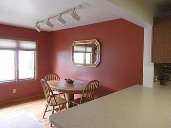 Spacious dining area offers newer wood floor