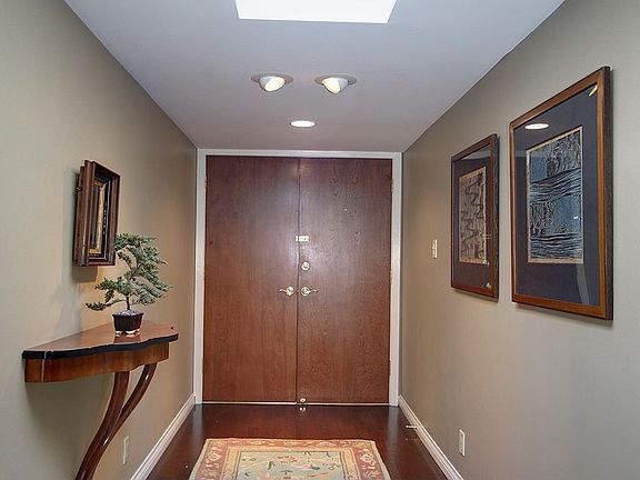 Double door entrance and formal entryway with its newly replaced skylight.