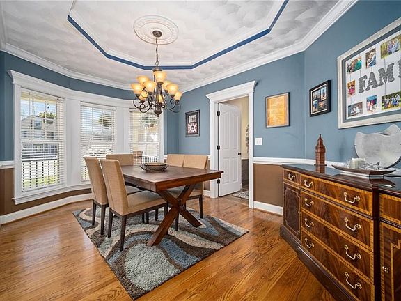 Dining Room - Beautiful Wood Floors.  Door Leads to Butlers Pantry