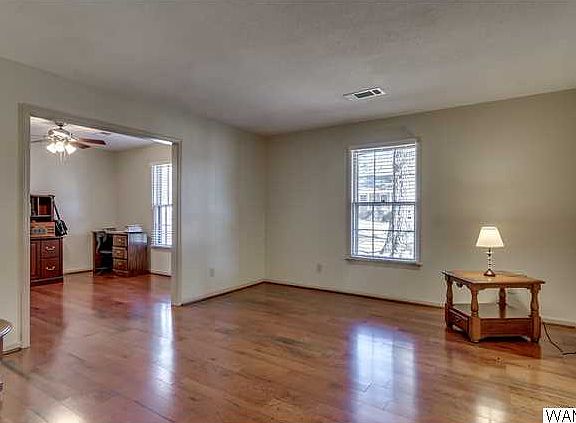 Looking to your right as you walk in the front door you are welcomed by a living room that is open to the dining room.  Both rooms feature new hardwood flooring.