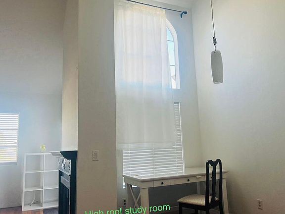 extra studying area space with high ceiling and high windows.