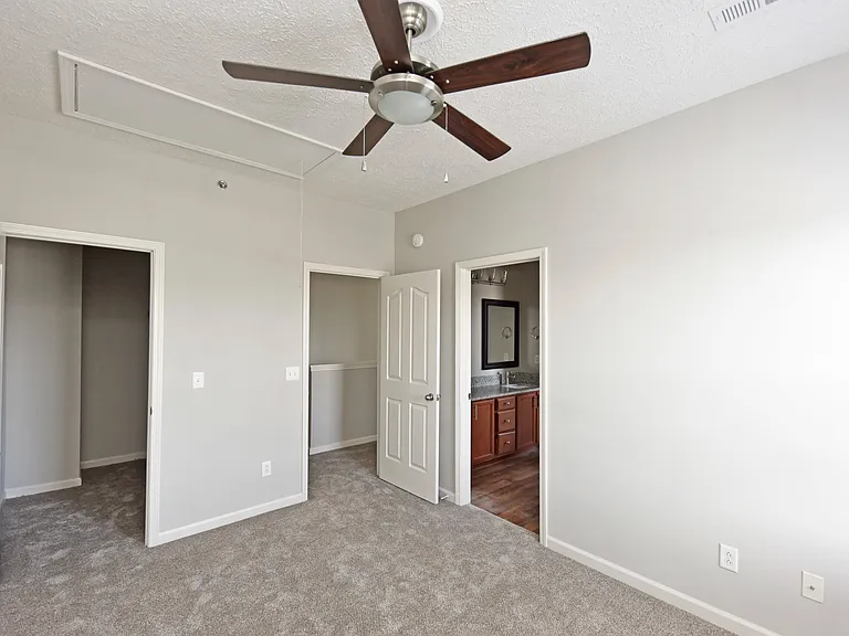 Bedroom with carpet & ceiling fan