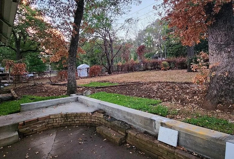 Backyard with tons of tress and shades