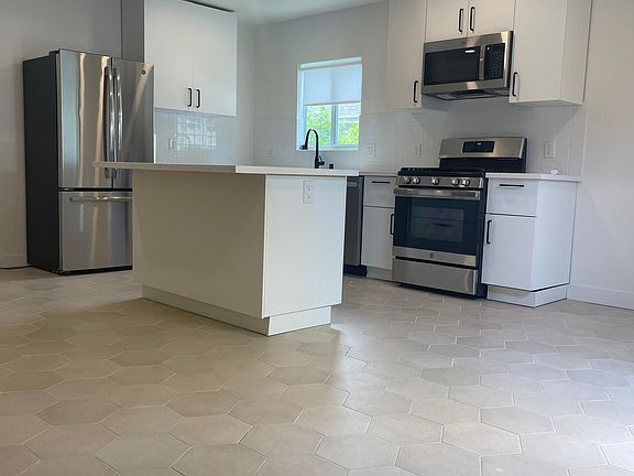 Kitchen and kitchen island with wine chiller