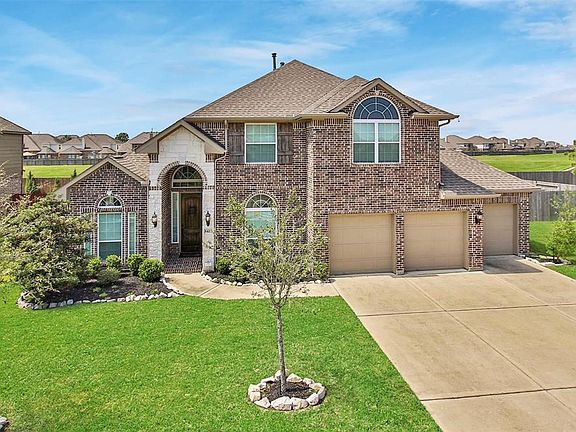 Beautiful all brick exterior with stone accents and 3 car garage.