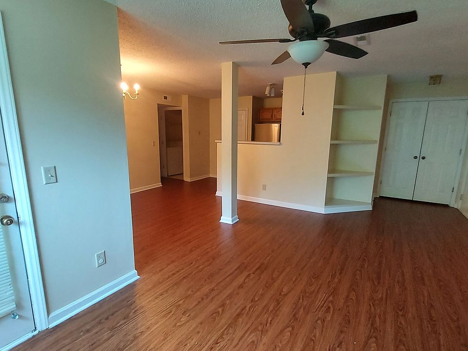 Family, dining, kitchen, and hall way entrance.