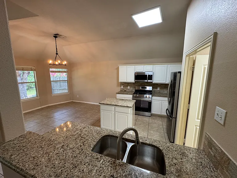 Another view of kitchen and breakfast area