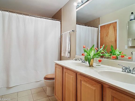 Full bath with his and her sinks