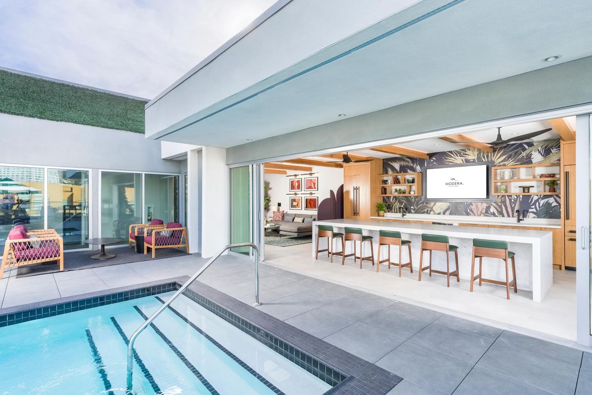 Enjoy poolside drinks and views at our resort-style rooftop with an outdoor bar.