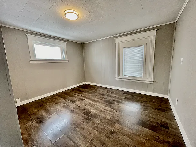 Large bedroom approx 13x14 with laminate wood flooring.