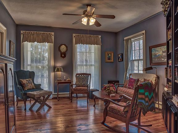 Living room with flat screen TV in cabinet.