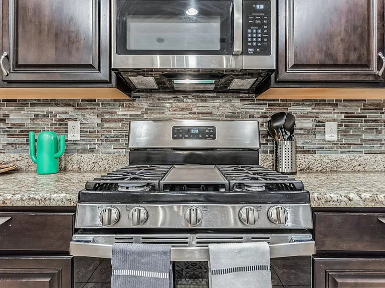 Large gas range with microwave oven.