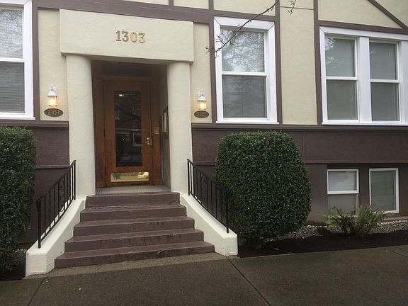Main entrance has a classic Oak door with rounded frame, marble covered wall. Security coded door.