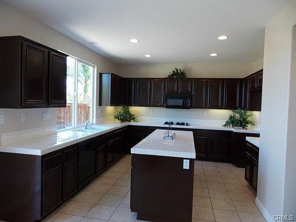 Kitchen with refinished cabinets throughout