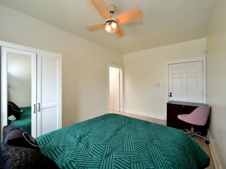spacious and bright bedroom with furnishings + brand new ceiling fans and mini split AC