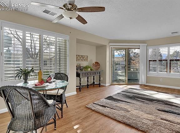 Open floor plan with new flooring, plantation shutters and perfect alcove for large TV (wall mount already there) & walk out to covered patio.
