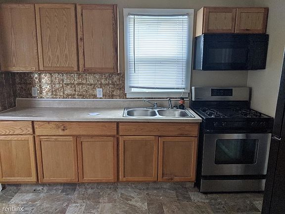Kitchen with new flooring and appliances