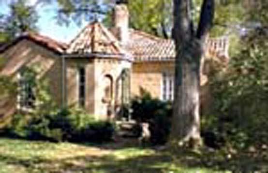 Front yard showing tile roof and great designs of this special Uni Hill home