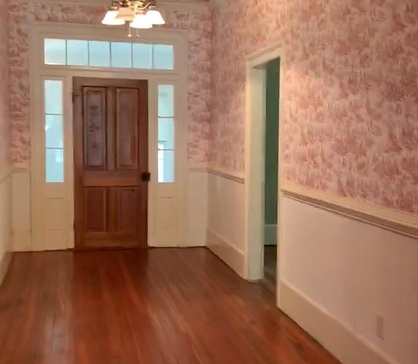 high ceilings, original hardwood floors, and loads of beautiful woodwork throughout the home.