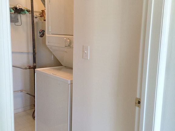 washer adn dryer in unit with separate room