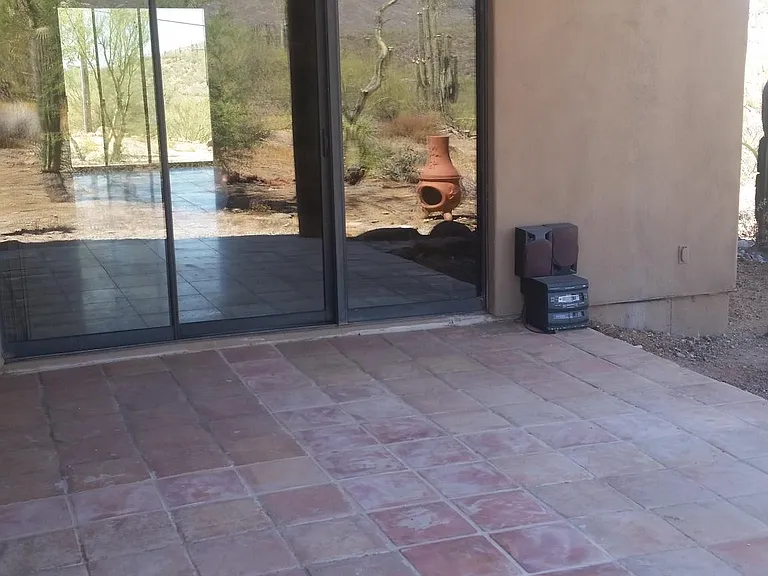 Shaded Patio off the Living room now served with Pavers