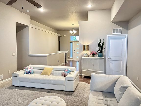 Foyer leading into the living room. Guest bedroom and bathroom are immediately to the right upon entry with a coat closet to the left. Door from living room leads to the laundry/mudroom and out to the 3 car garage