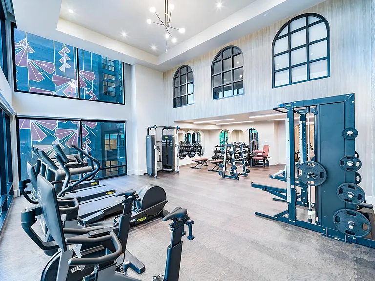 A light-filled fitness studio at Modera University Park, supporting your routine with easy access to University Park's trails and green spaces.