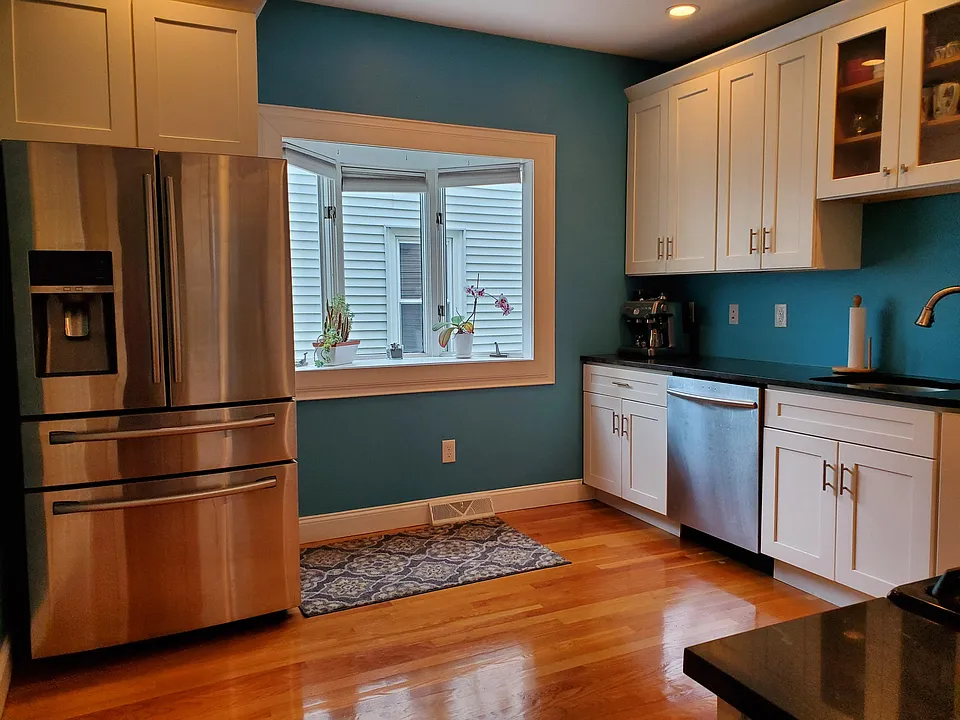 Kitchen area with dishwasher, french door refrigerator, stove/oven, and microwave