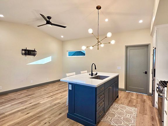 Tv mounts, designer lighting and high ceilings.