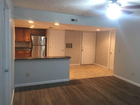 Living room facing the kitchen (laundry next to frig)