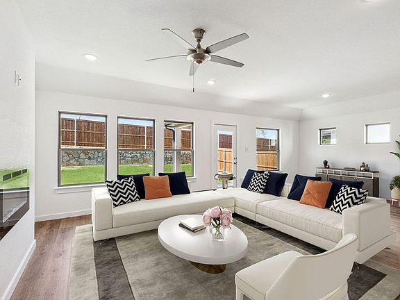 Living Room in the Emmy II home plan by Trophy Signature Homes - REPRESENTATIVE PHOTO