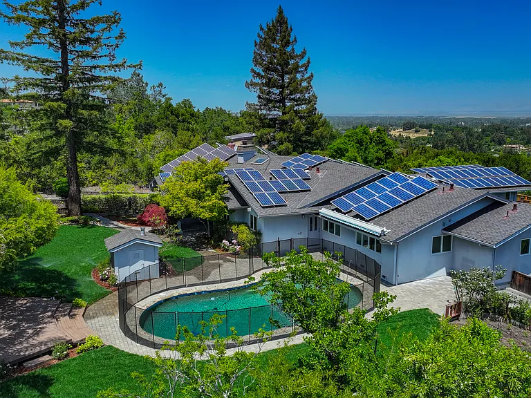 This tranquil home is located at the end of a cul-de-sac featuring a sparkling pool at the front and a wonderful rear upper deck beckoning for entertainment or relaxation, offering a spectacular view of the bay.