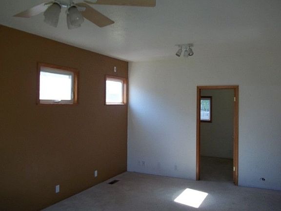 Living room looking into back bedroom