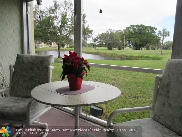 VIEW FROM THE PATIO OF THE WATER AND THE 18TH T-BOX.GREAT, GREAT, LOCATION!