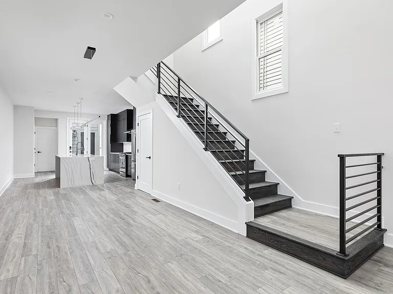 Looking into dining room and staircase to 2nd floor