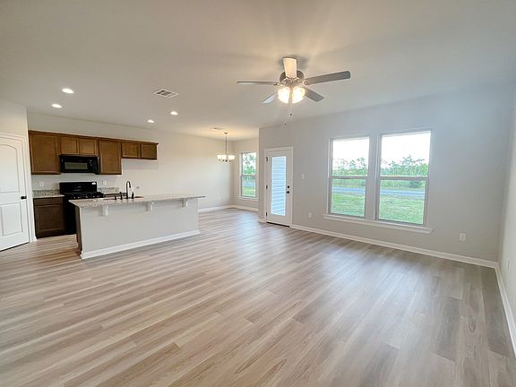 Raeford IV G - Kitchen, Dining, and Living Area - DSLD Homes