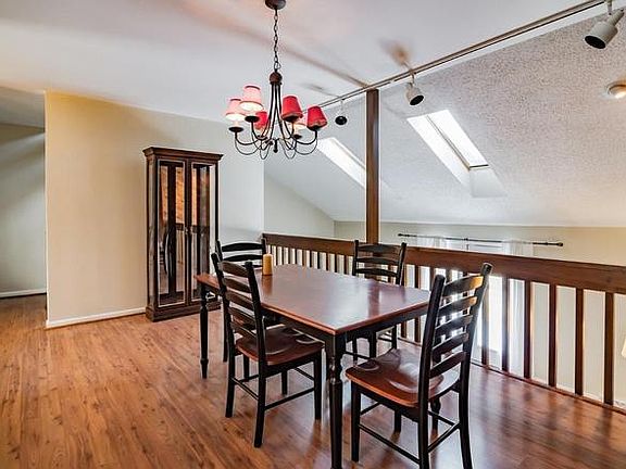 Dining Room overlooking Living room with Skylights