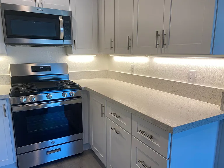 Kitchen has under cabinet lighting