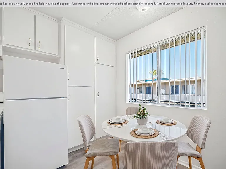 Bright dining space with a functional layout and nearby kitchen access.