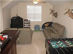 This bonus room has tons of hidden attic storage.  