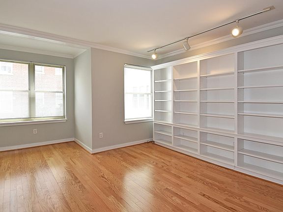 Large living and dining room with beautiful built ins
