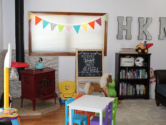 Back den with a wood bunring stove and great lighting, perfe