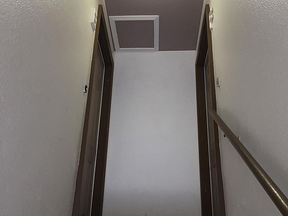 Stairwell to the apartment which is on the left side.