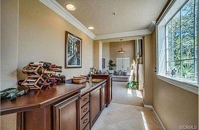 Wet bar can be accessed from both Living and Family Rooms.