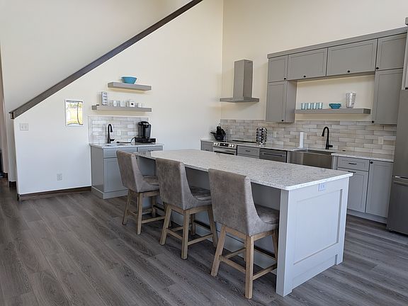 Fully furnished kitchen with generous cabinet storage.