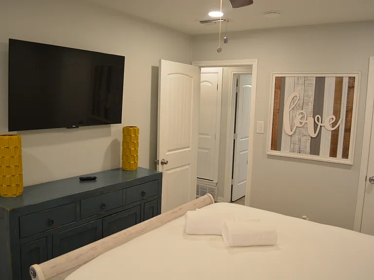 Bedroom 1 - a queen bed, smart tv and attached to bathroom 2.