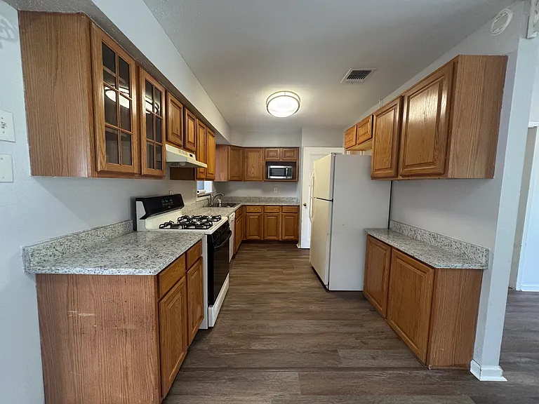New granite counters throughout the kitchen.