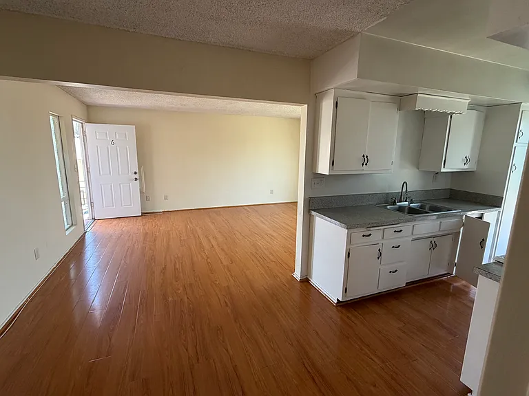 view of kitchen and living room from dining area.