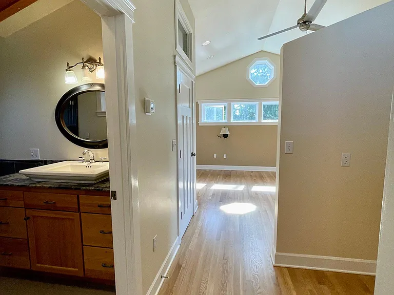 Primary en suite and dressing area leading to bedroom and sitting area or gym studio