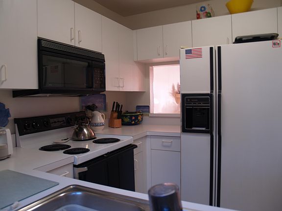 Second of two kitchen pictures, this one shows the pass through to the dining room.